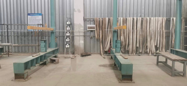Rows of transparent acrylic panels in a fabrication workshop